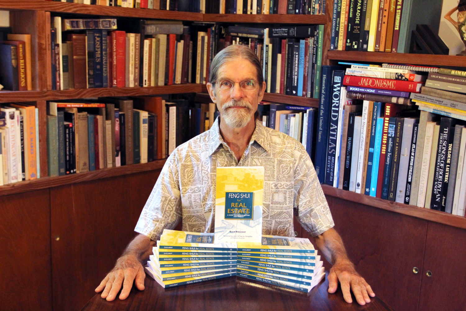 Author Clear Englebert sits with his newest book, Feng Shui for Real Estate